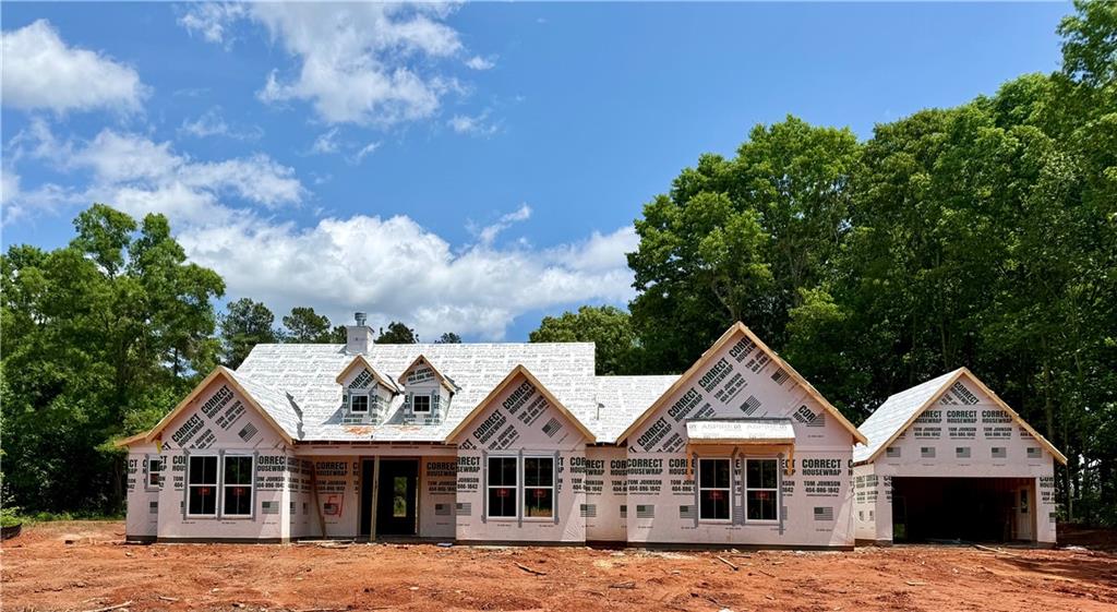a view of house with yard and entertaining space