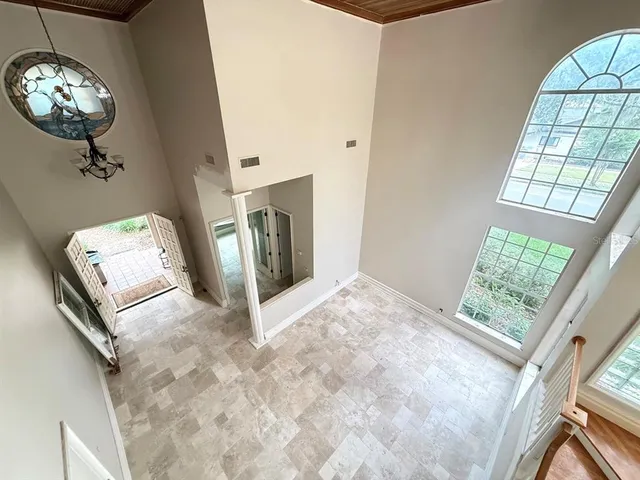 a view of livingroom with furniture and natural light