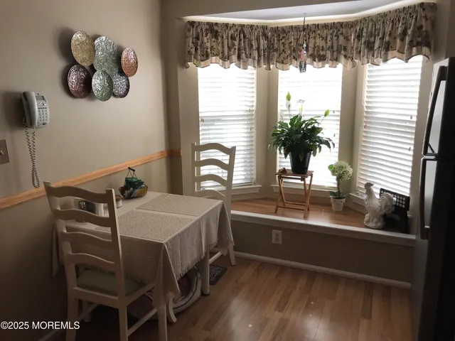 a kitchen with a sink and a large window