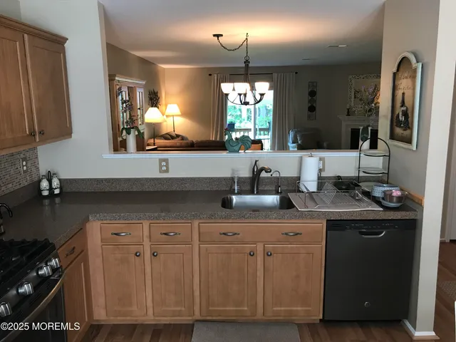 a kitchen with cabinets and stainless steel appliances