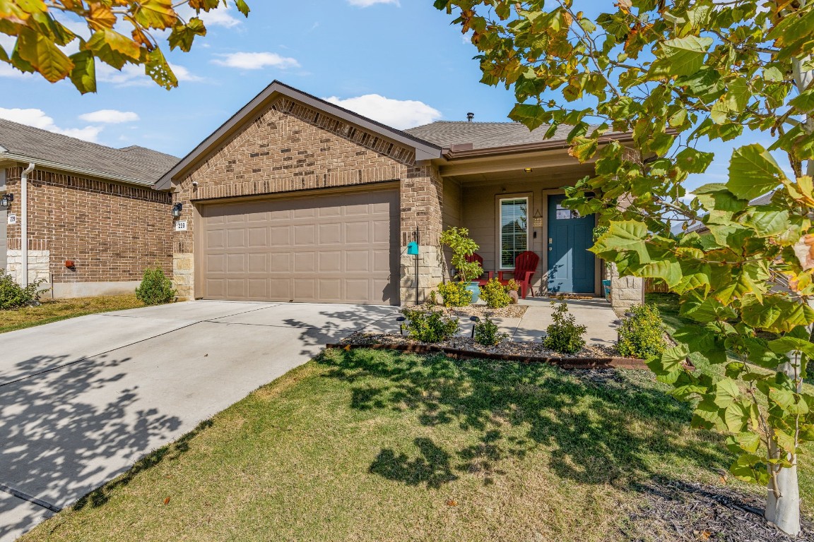 a front view of a house with garden