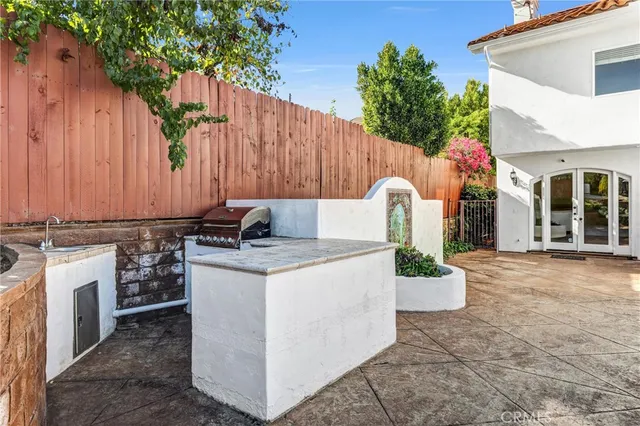 a swimming pool with outdoor seating and yard