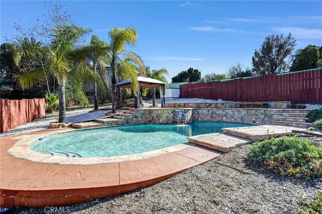 a view of a house with a yard and tree s