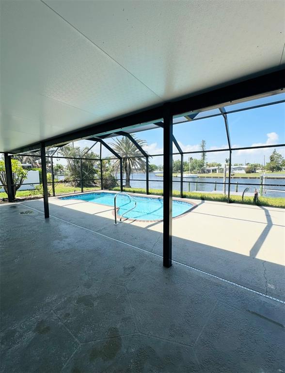 342 Severin Road Southeast Port Charlotte, FL 33952 - Photo 14 of 22 a view of an empty room with large windows