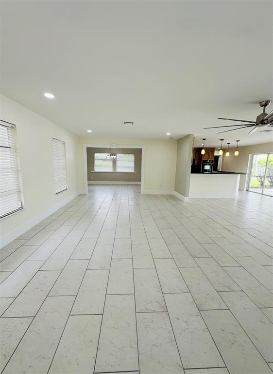 342 Severin Road Southeast Port Charlotte, FL 33952 - Photo 4 of 22 a view of a livingroom with an empty space and window