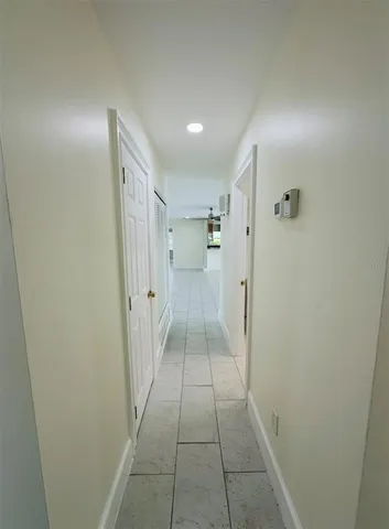 a bathroom with a double vanity sink toilet and a tub