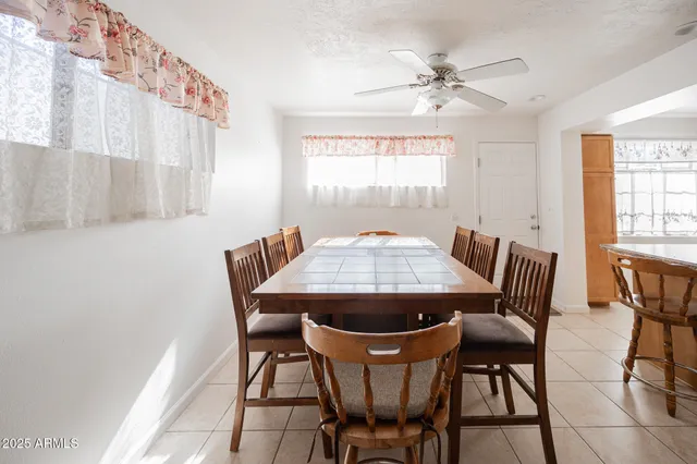 a view of a dining room with furniture and window