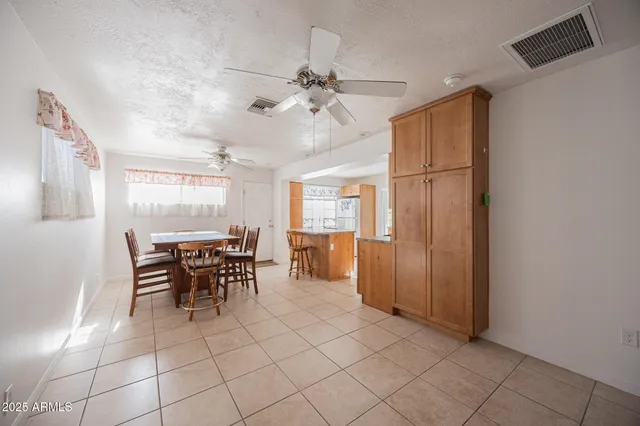 a view of a livingroom with furniture and chandelier