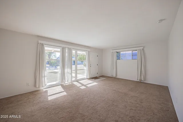 an empty room with windows