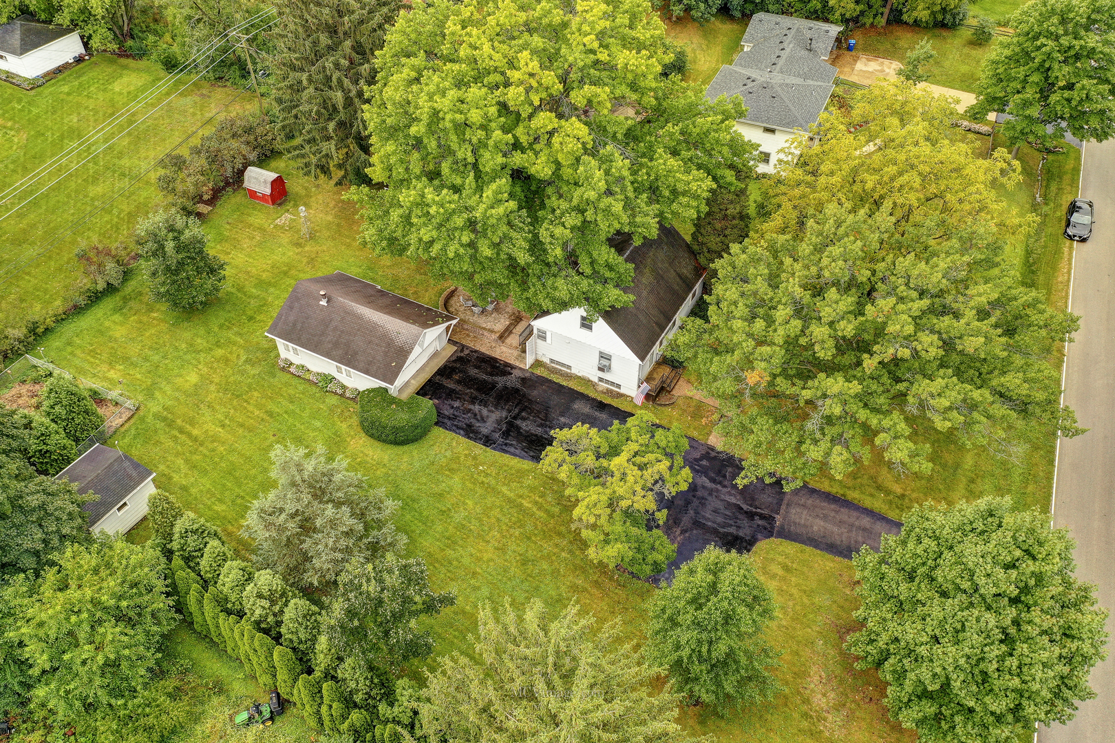 591 Riedy Road Lisle, IL 60532 - Photo 1 of 37 a backyard of a house with lots of green space