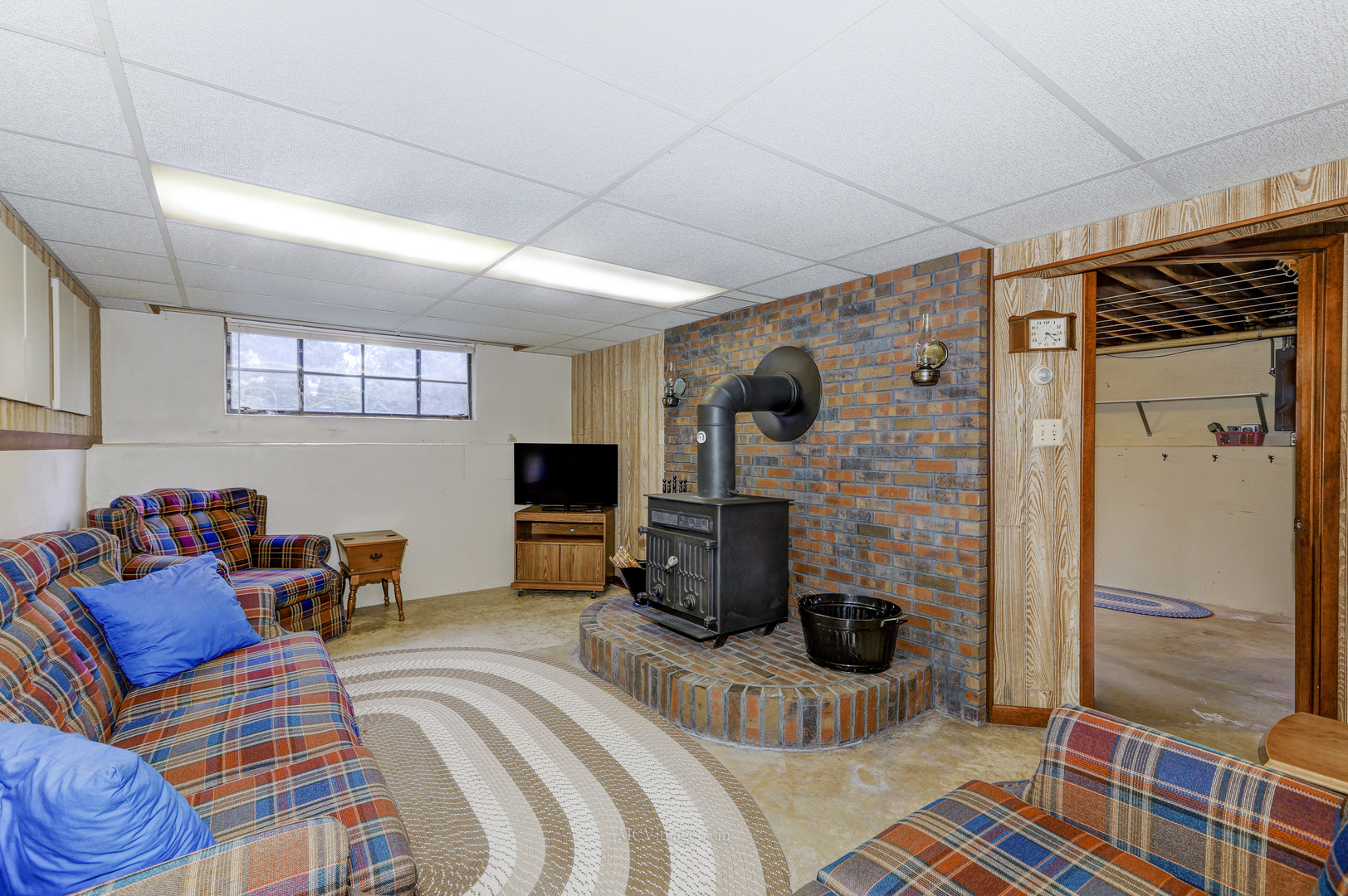 591 Riedy Road Lisle, IL 60532 - Photo 16 of 37 a bedroom with furniture and a flat screen tv