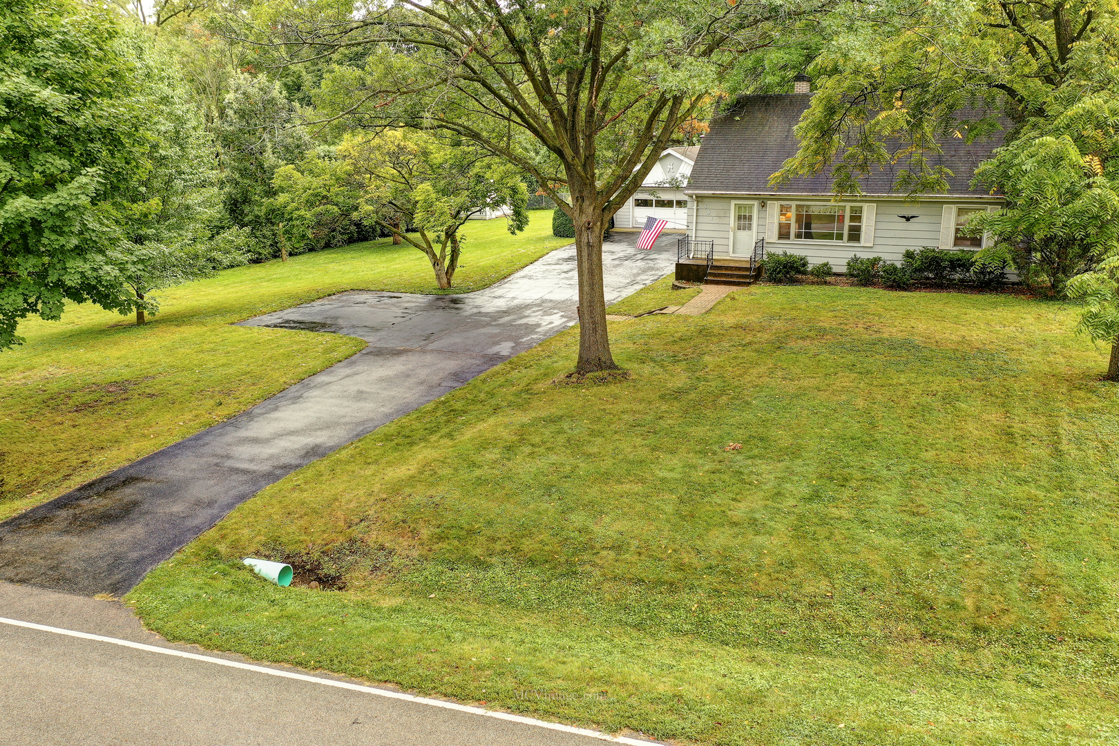 591 Riedy Road Lisle, IL 60532 - Photo 32 of 37 a view of a swimming pool with a patio and a yard