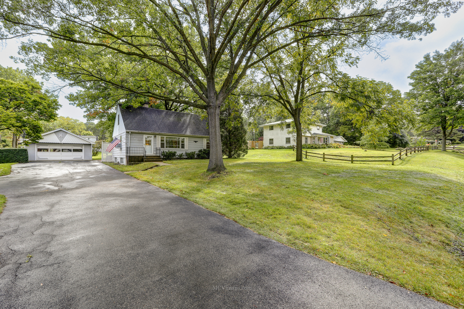 591 Riedy Road Lisle, IL 60532 - Photo 36 of 37 a view of a house with a big yard and large trees