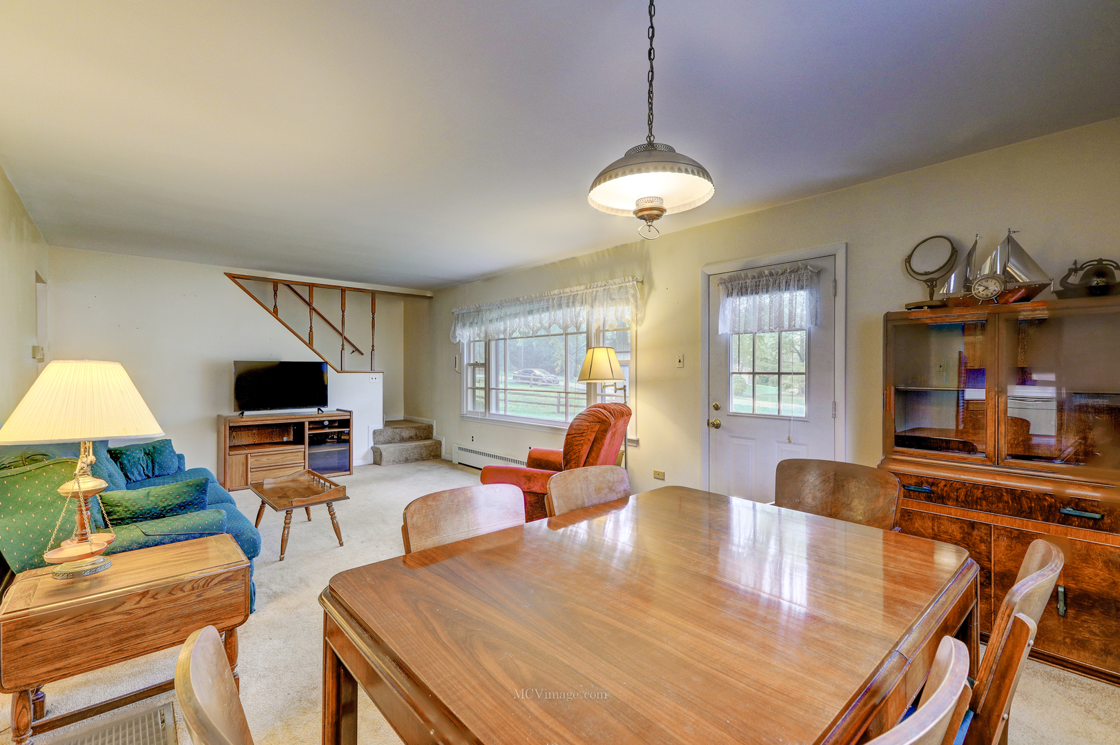 591 Riedy Road Lisle, IL 60532 - Photo 6 of 37 a living room with fireplace furniture and a flat screen tv