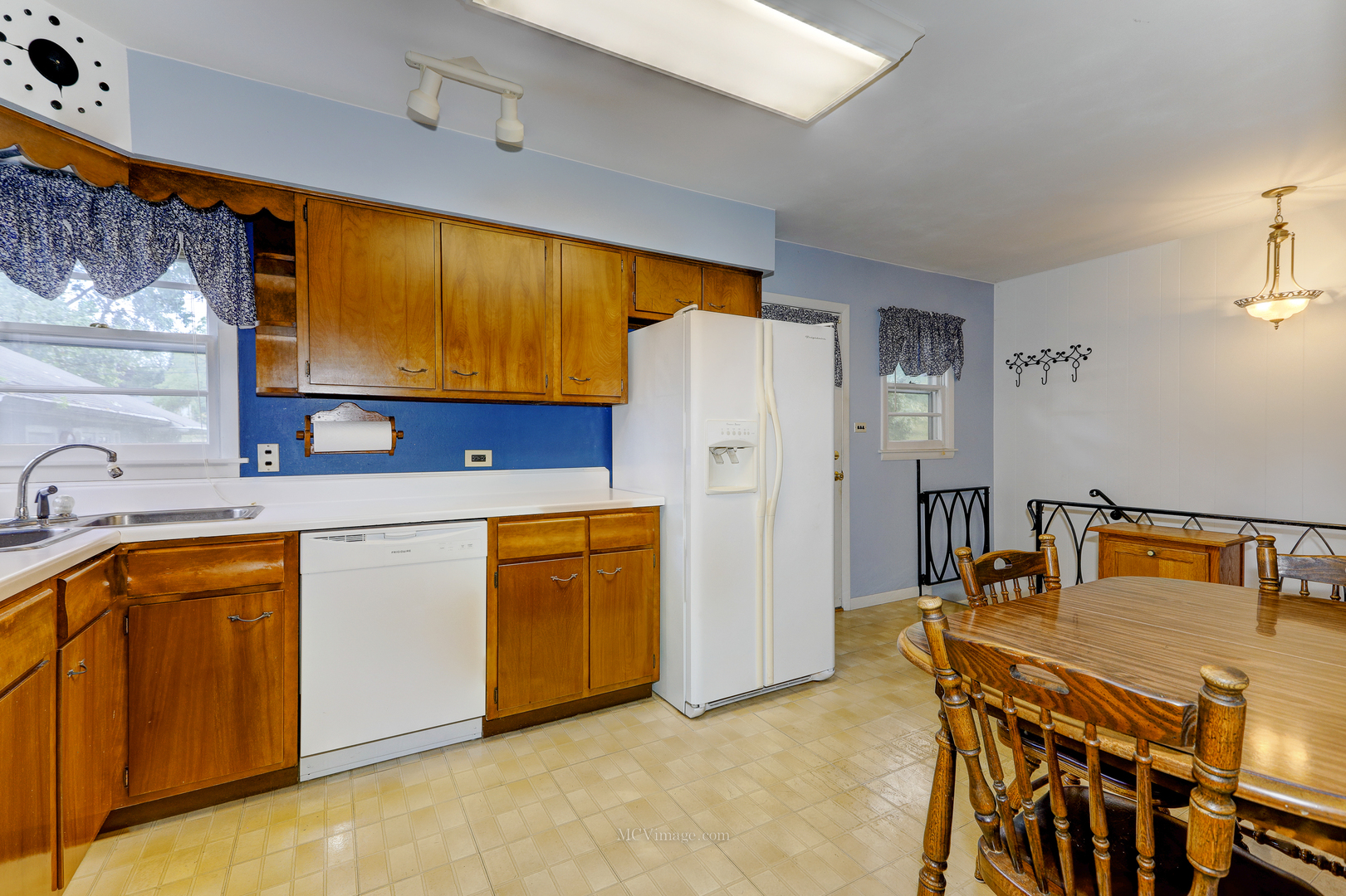 591 Riedy Road Lisle, IL 60532 - Photo 7 of 37 a kitchen with a refrigerator and a sink