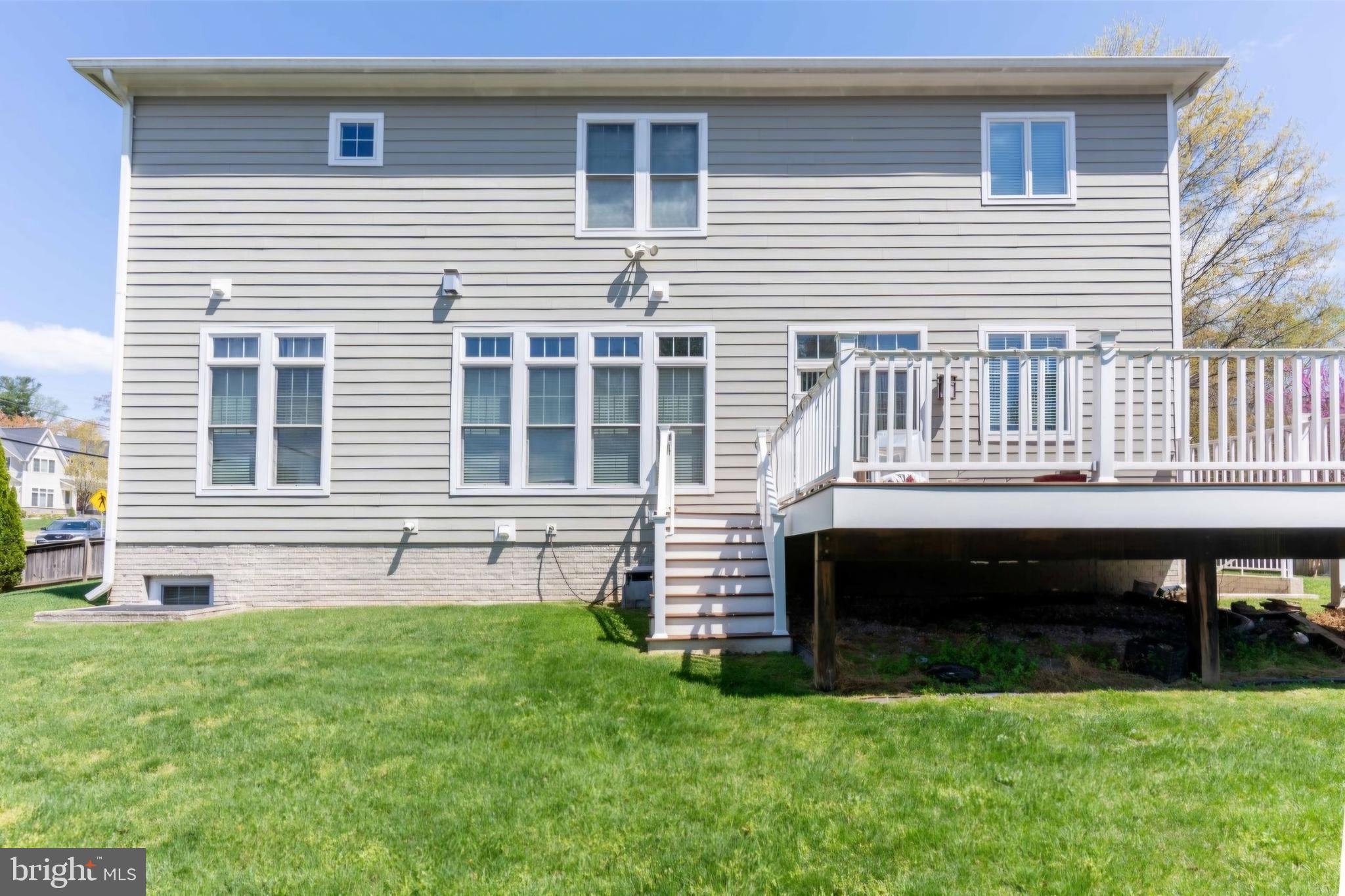 801 Meadow Lane Southwest Vienna, VA 22180 - Photo 15 of 24 a front view of a house with a garden