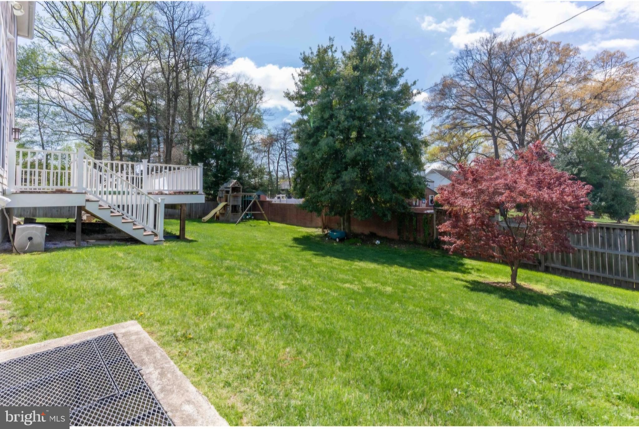 801 Meadow Lane Southwest Vienna, VA 22180 - Photo 18 of 24 a view of a house with a backyard and a patio