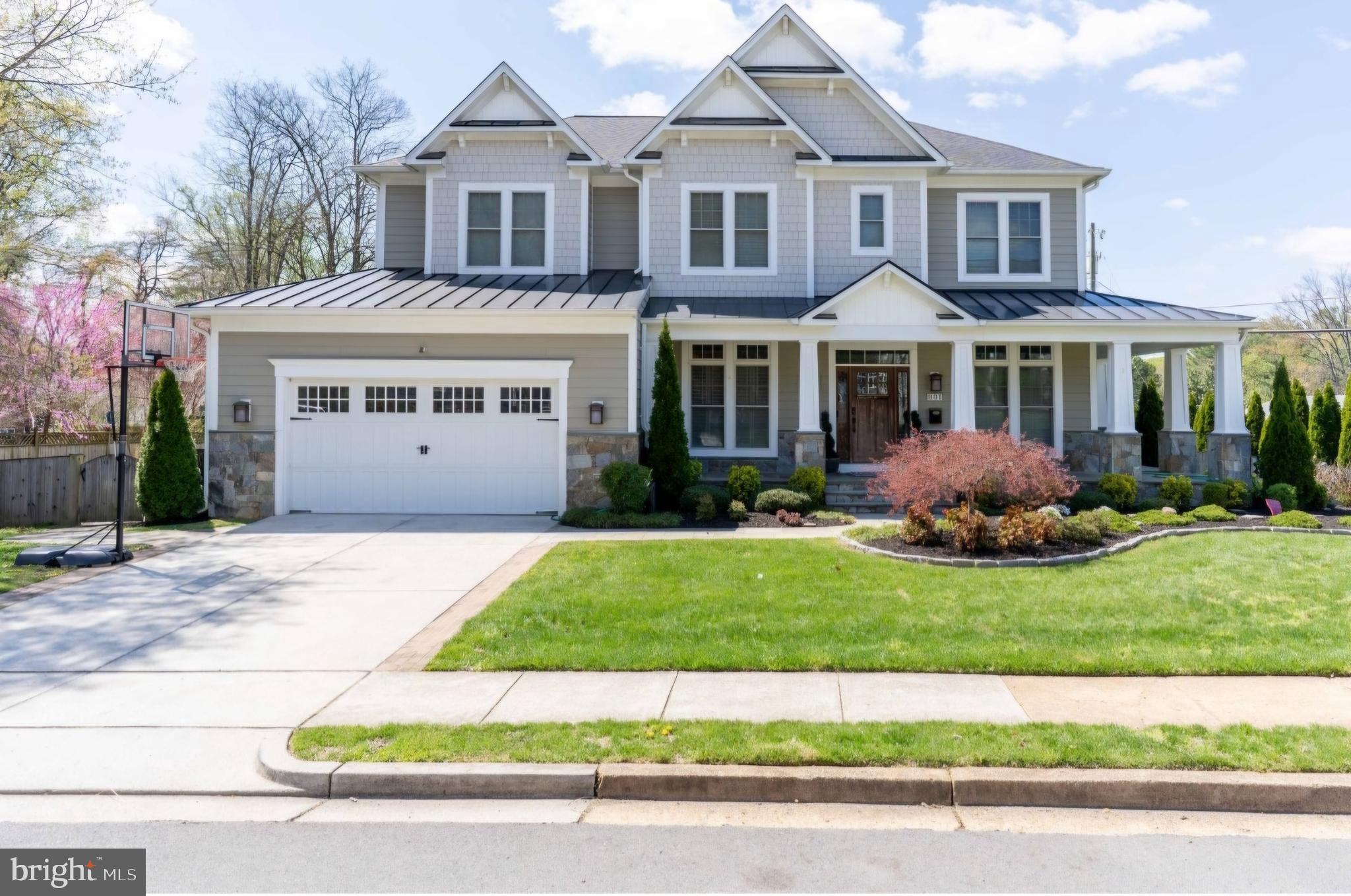 801 Meadow Lane Southwest Vienna, VA 22180 - Photo 2 of 24 a front view of a house with a garden and yard