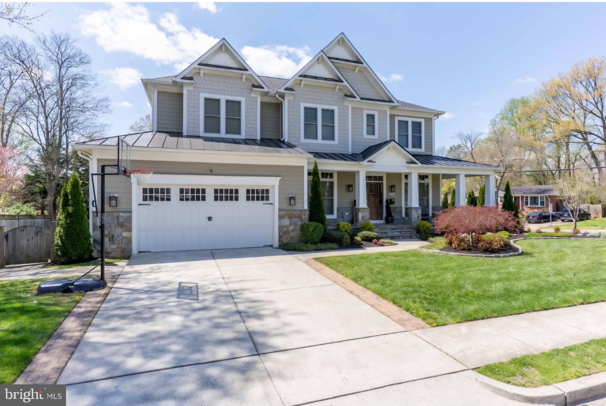 801 Meadow Lane Southwest Vienna, VA 22180 - Photo 3 of 24 a front view of a house with a yard and potted plants