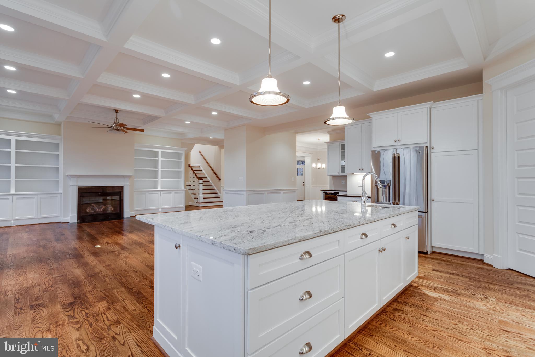 801 Meadow Lane Southwest Vienna, VA 22180 - Photo 6 of 24 a kitchen with stainless steel appliances kitchen island granite countertop a stove a sink and a refrigerator