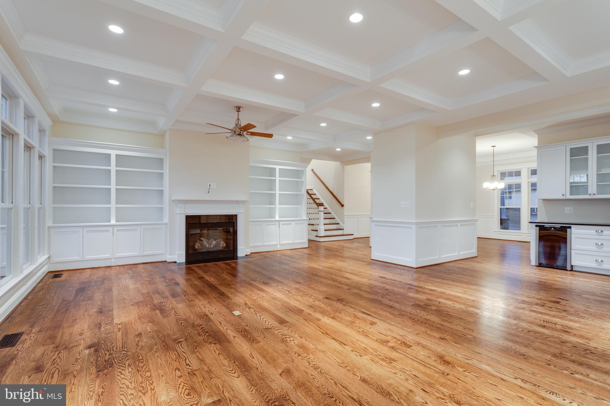 801 Meadow Lane Southwest Vienna, VA 22180 - Photo 7 of 24 a view of a room with wooden floor and a fireplace