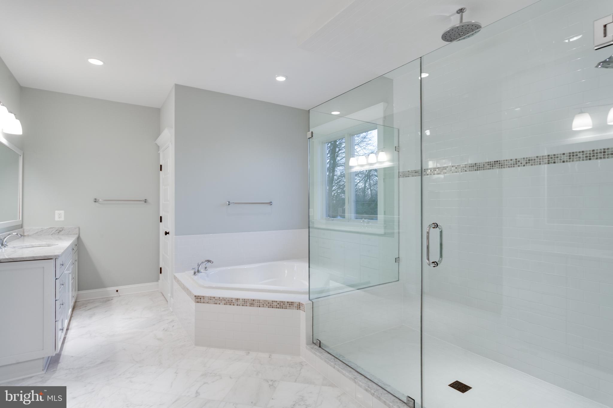 801 Meadow Lane Southwest Vienna, VA 22180 - Photo 10 of 24 a bathroom with a bathtub and a shower