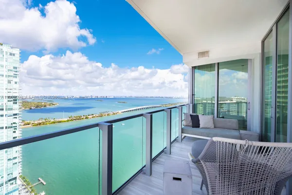 a view of balcony with furniture