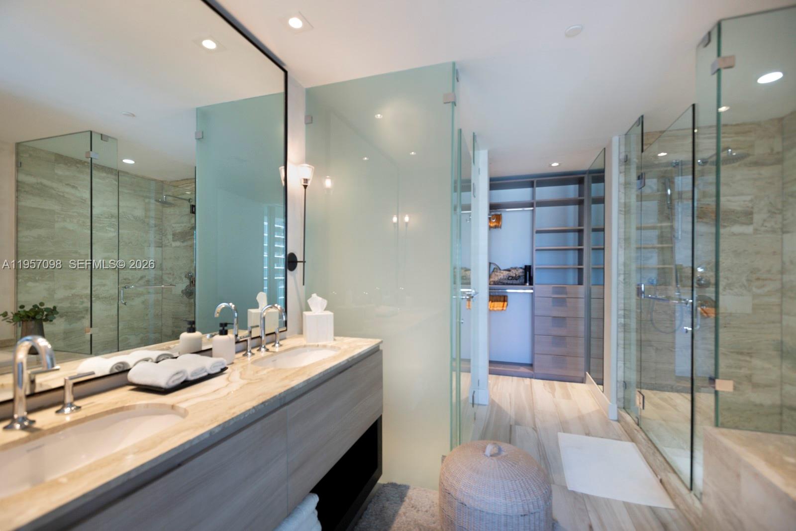 2900 Northeast 7th Avenue, Unit 3701 Miami, FL 33137 - Photo 13 of 23 a bathroom with a double vanity sink and mirror