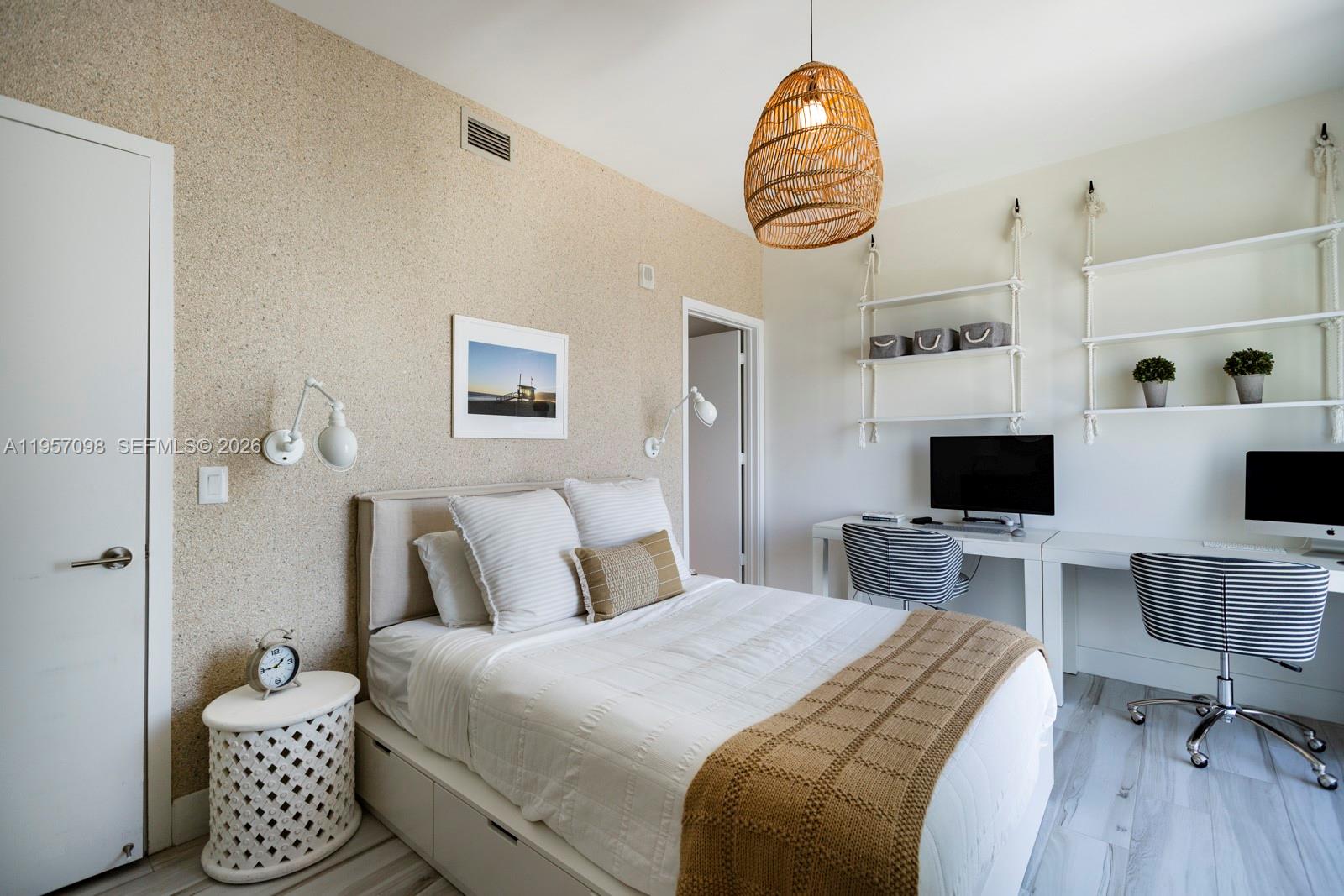 2900 Northeast 7th Avenue, Unit 3701 Miami, FL 33137 - Photo 15 of 23 a bedroom with a bed and a chandelier