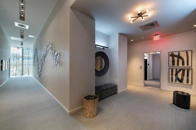 a view of a hallway with windows