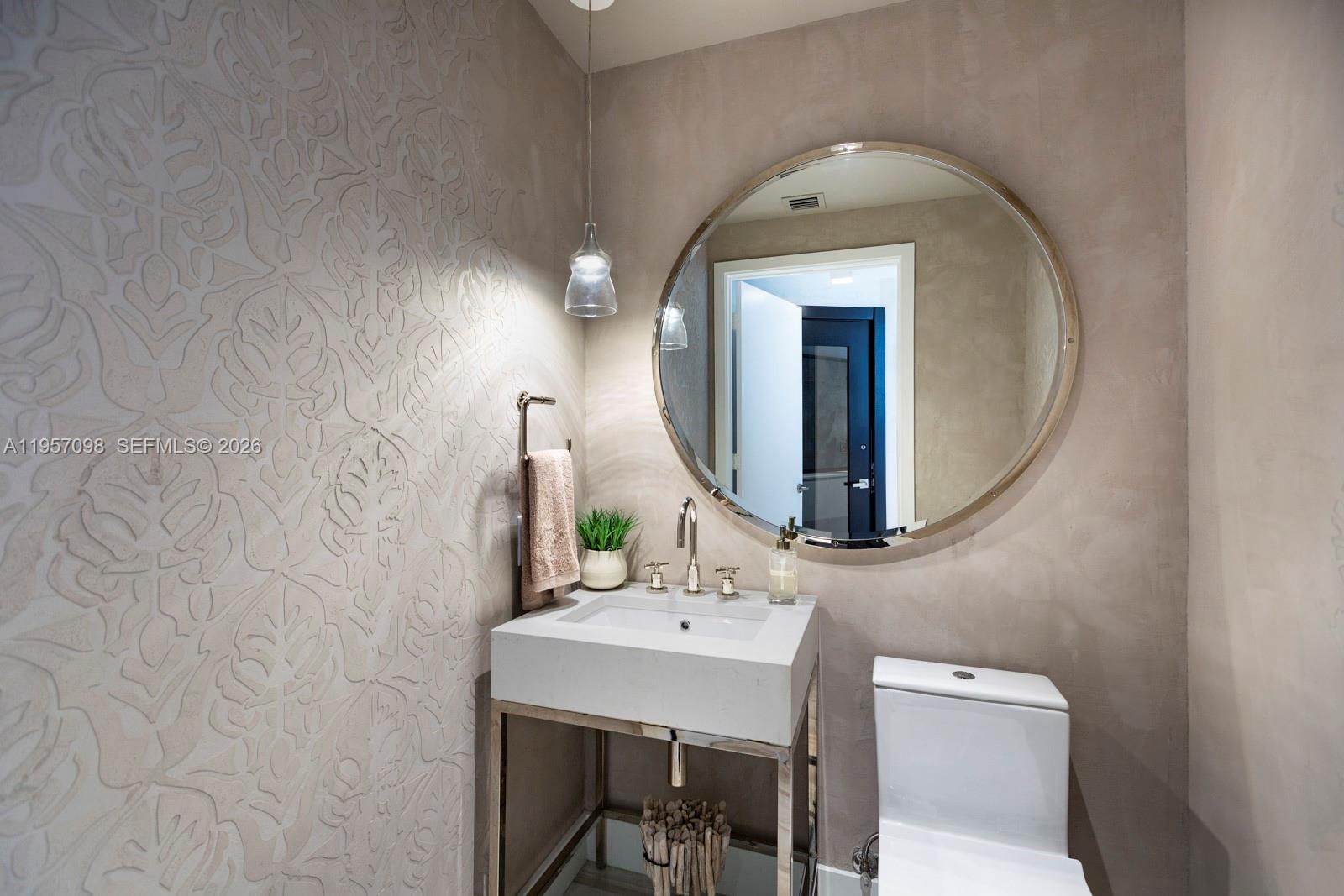 2900 Northeast 7th Avenue, Unit 3701 Miami, FL 33137 - Photo 5 of 23 a bathroom with a toilet sink and mirror