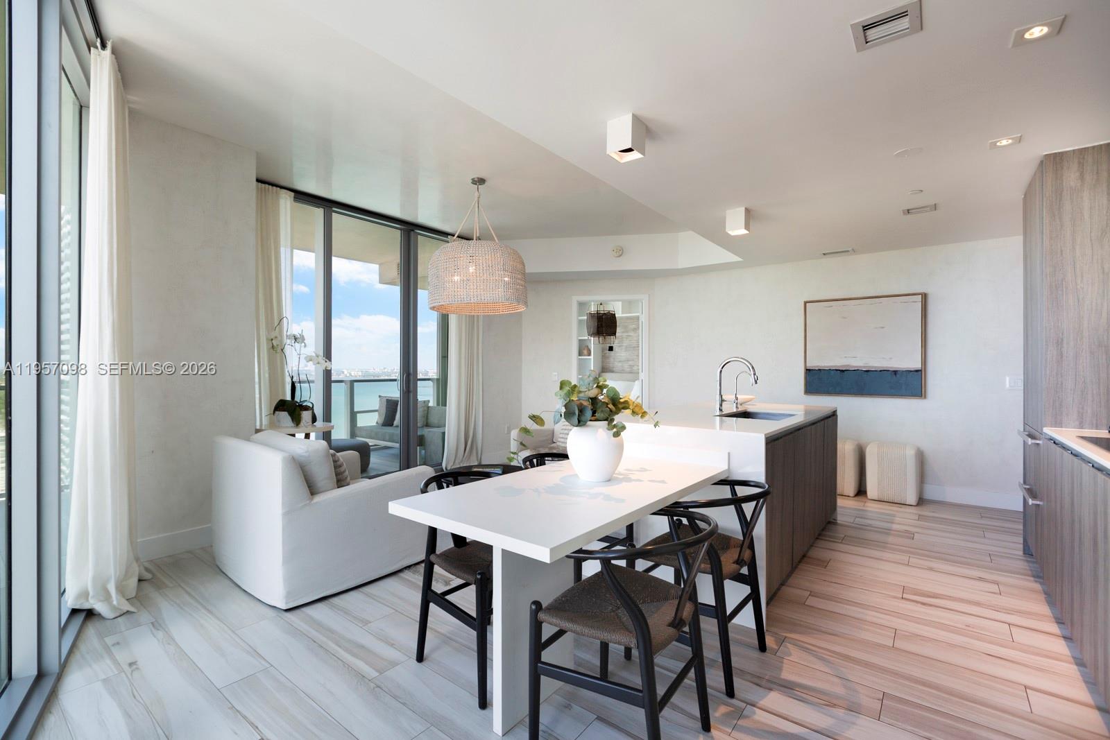 2900 Northeast 7th Avenue, Unit 3701 Miami, FL 33137 - Photo 9 of 23 a view of a dining room with furniture and wooden floor