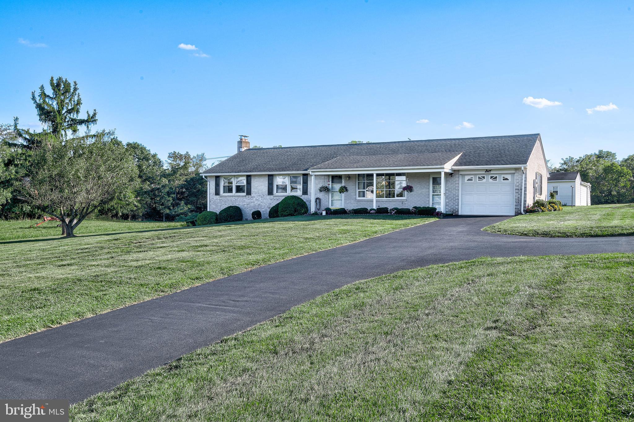 1280 Kunkle's Mill Road Wellsville, PA 17365 - Photo 1 of 40 a house view with a garden space