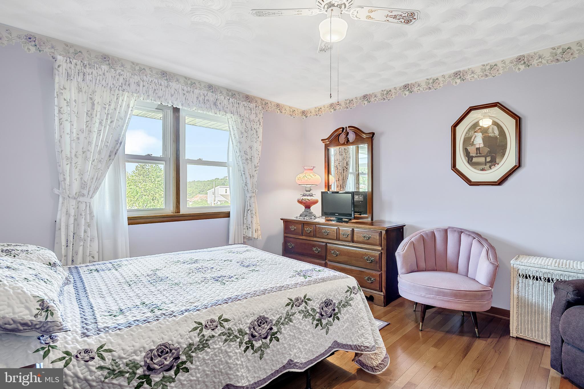 1280 Kunkle's Mill Road Wellsville, PA 17365 - Photo 14 of 40 a bedroom with a bed and a chair