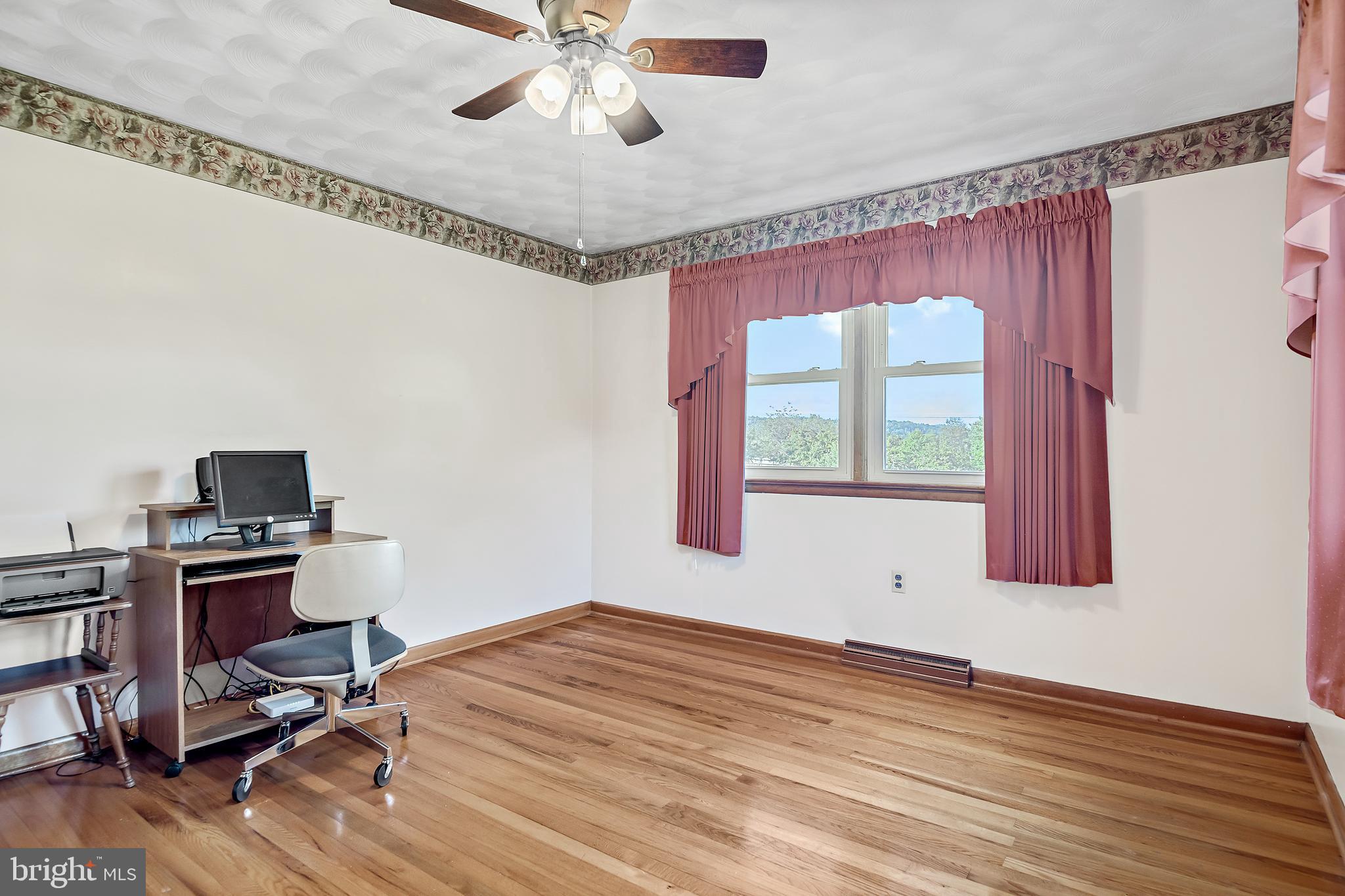 1280 Kunkle's Mill Road Wellsville, PA 17365 - Photo 18 of 40 a view of a workspace with furniture and a window