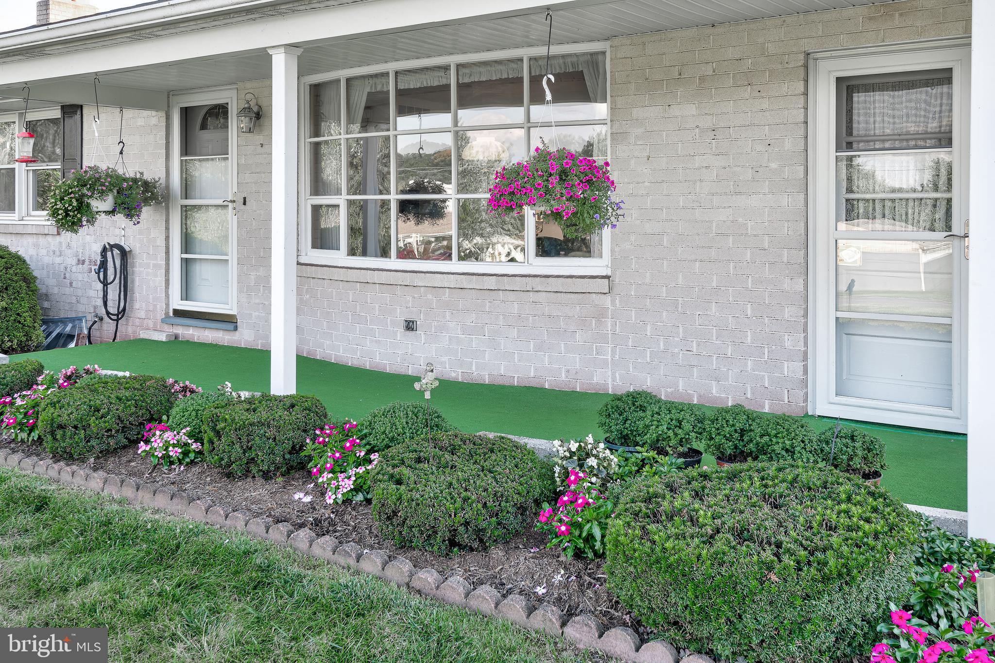 1280 Kunkle's Mill Road Wellsville, PA 17365 - Photo 26 of 40 a flower garden in front of house