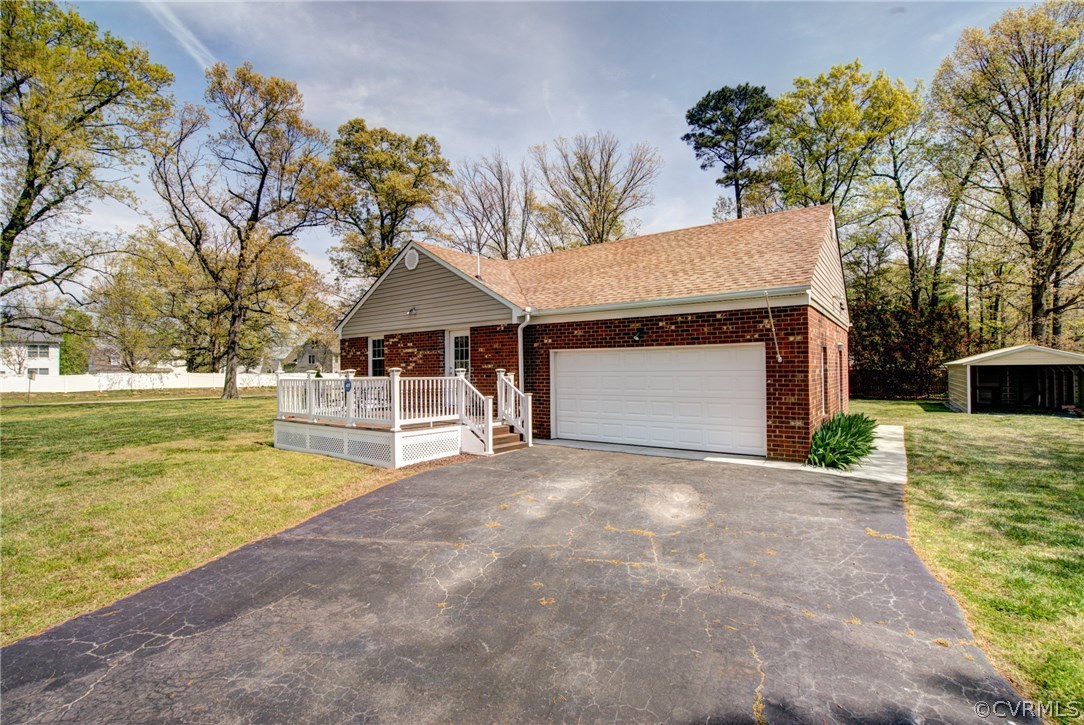 301 Meadowville Road Chester, VA 23836 - Photo 21 of 25 a front view of a house with a yard garage and outdoor seating