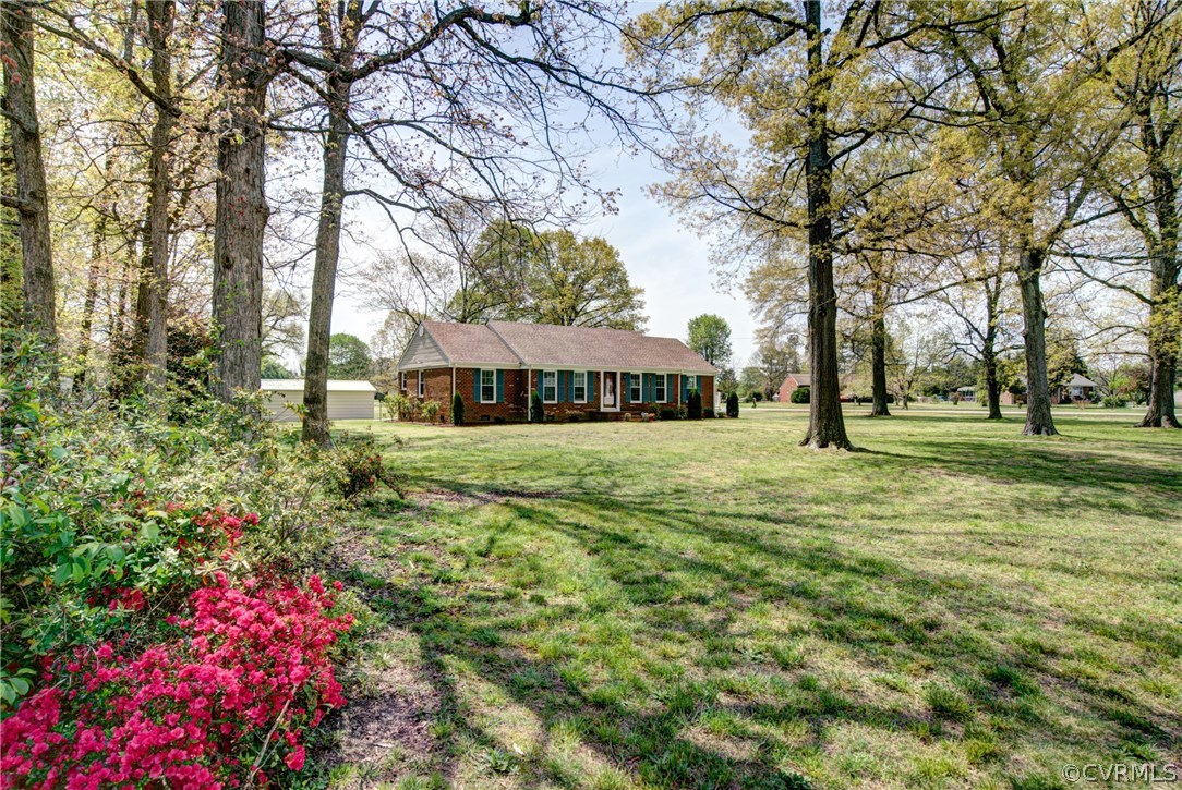 301 Meadowville Road Chester, VA 23836 - Photo 3 of 25 a front view of a house with a yard