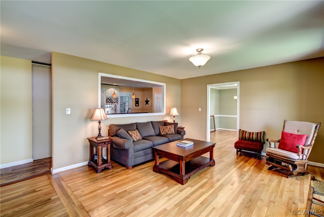 301 Meadowville Road Chester, VA 23836 - Photo 7 of 25 a living room with furniture and a wooden floor
