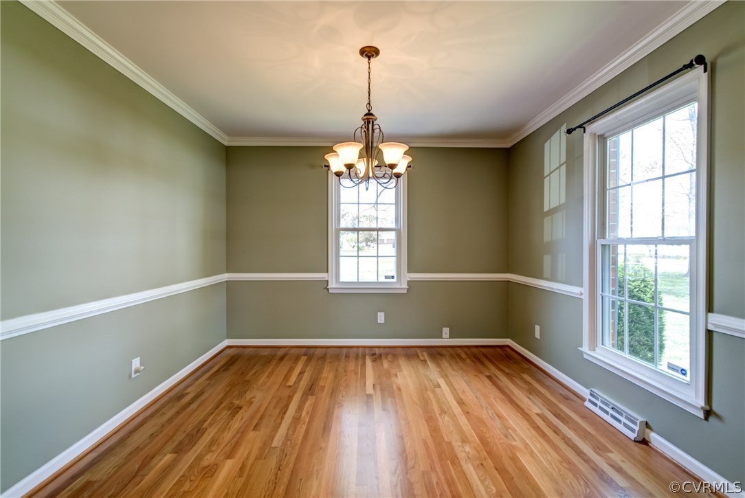 301 Meadowville Road Chester, VA 23836 - Photo 8 of 25 a view of empty room with wooden floor and fan