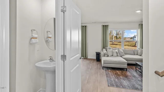 a bathroom with a tub shower and sink