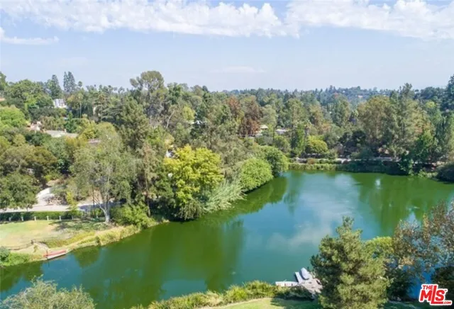 a view of a lake with an outdoor space and seating area