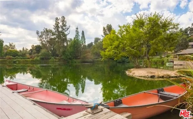 a view of a house with backyard and a patio