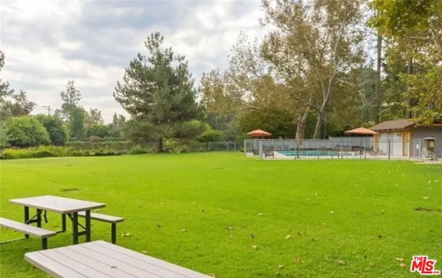 a view of a big yard with a fountain