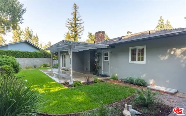 a view of a room with wooden floor and windows