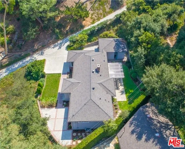 a view of a backyard with sitting area