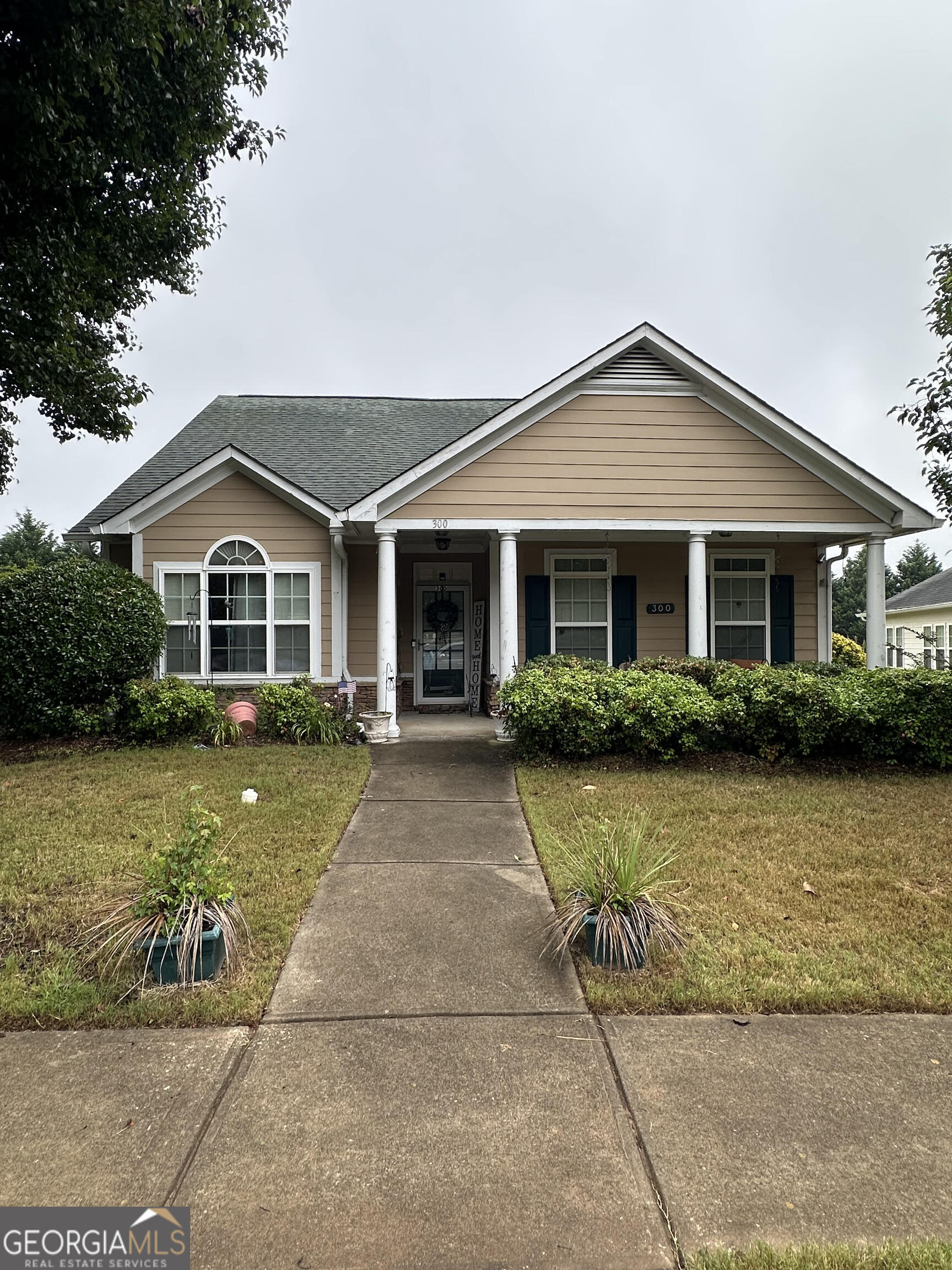 300 Monarch Village Way Stockbridge, GA 30281 - Photo 2 of 2 a front view of a house with a yard