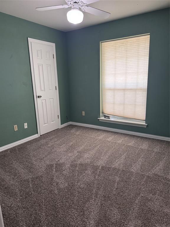1704 South Bowen Road Pantego, TX 76013 - Photo 22 of 37 Carpeted interior room featuring new carpet, a ceiling fan with integrated lighting, a window with horizontal blinds, and a white six-panel door