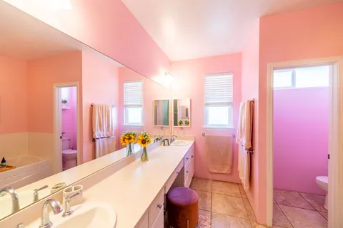 a bathroom with a tub sink and toilet