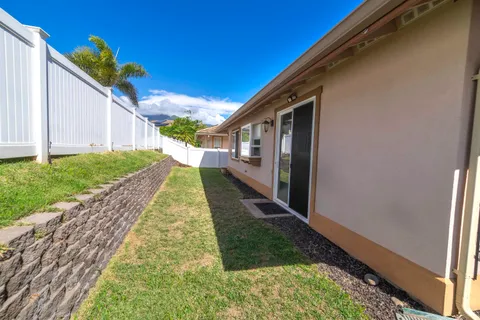 a view of a backyard with pathway